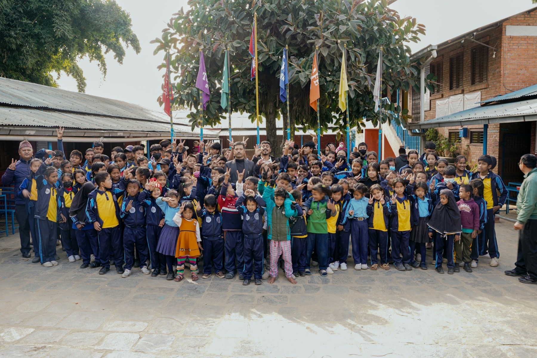 Students and educators gather at school in coordinated uniforms during Dress Proudly